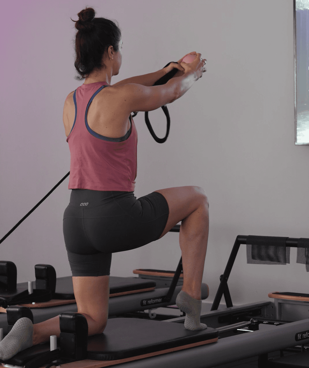 Member training during a Reformer Pilates class at Align by Cube