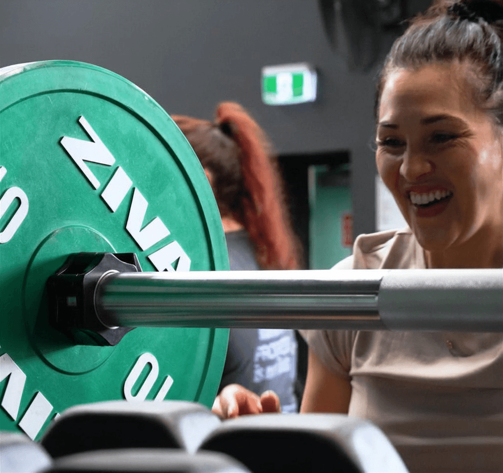 A Cube Fitness member enjoying strength training